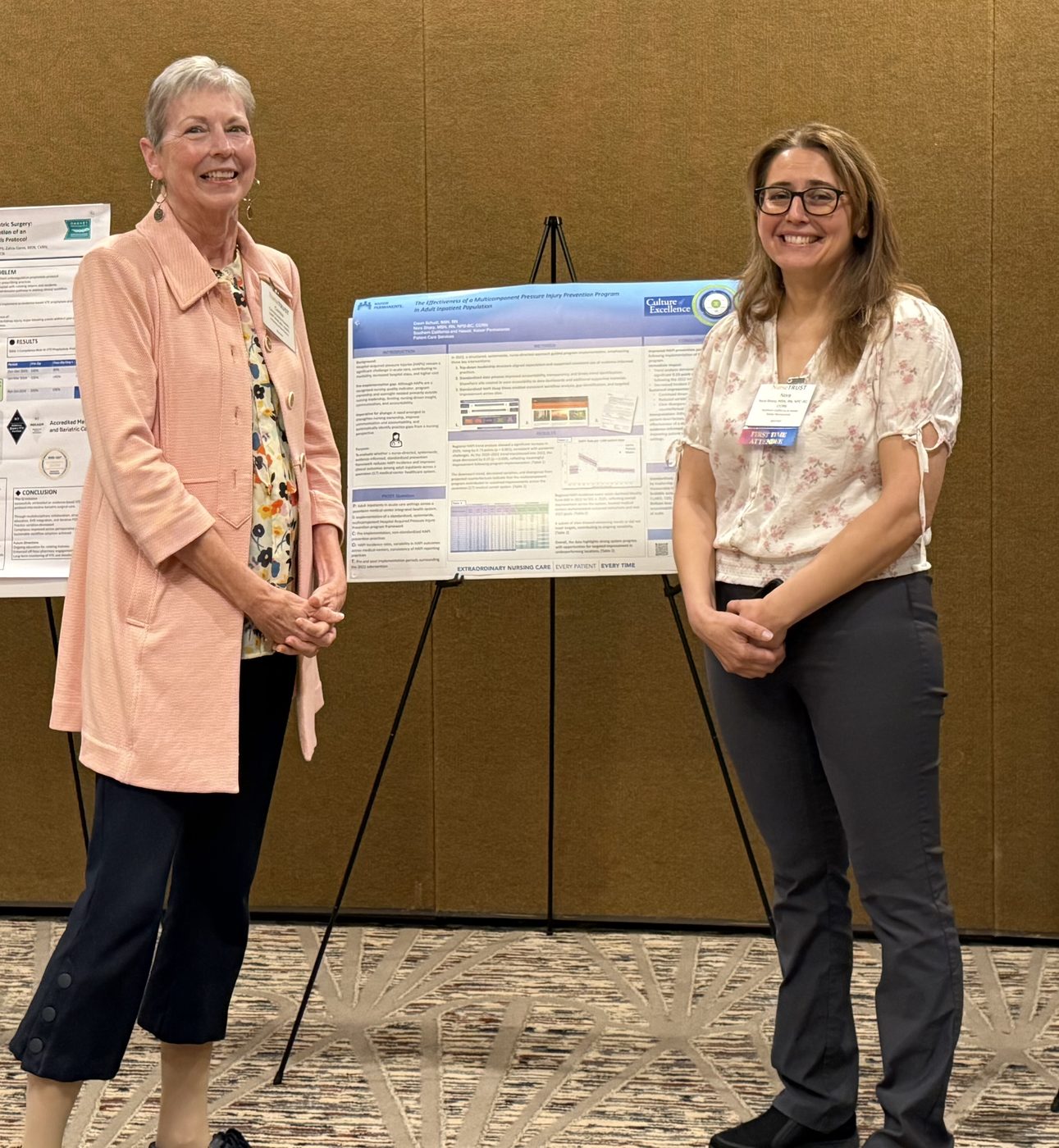 Presenters with a research poster